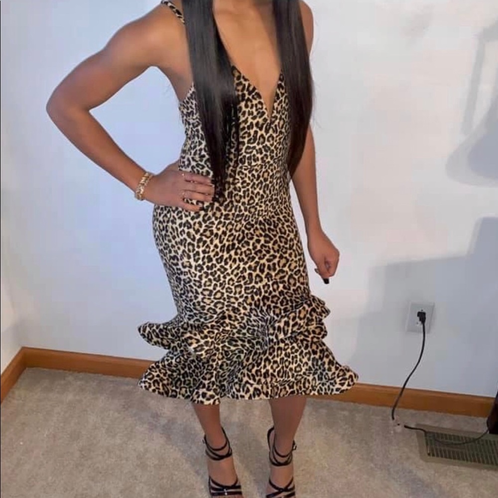Leopard print dress with ruffled bottom.